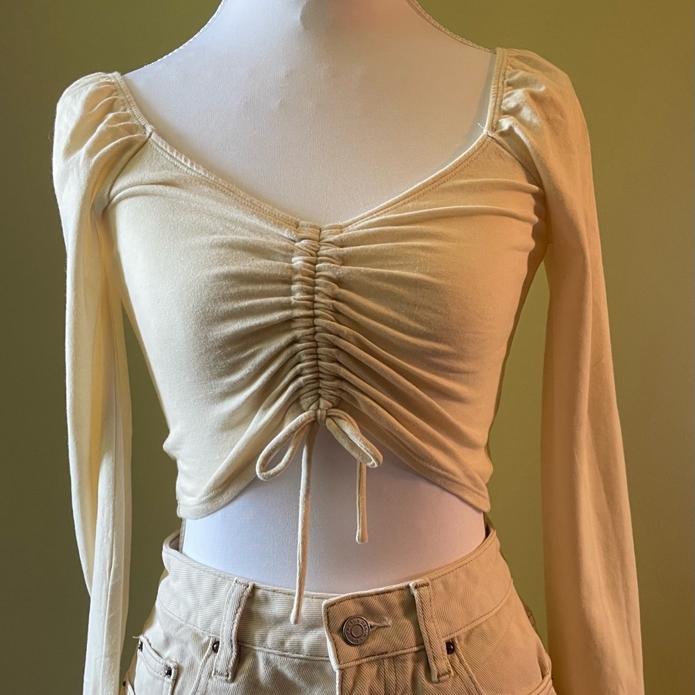 Me to We Cream Ruched Long Sleeve Crop Top